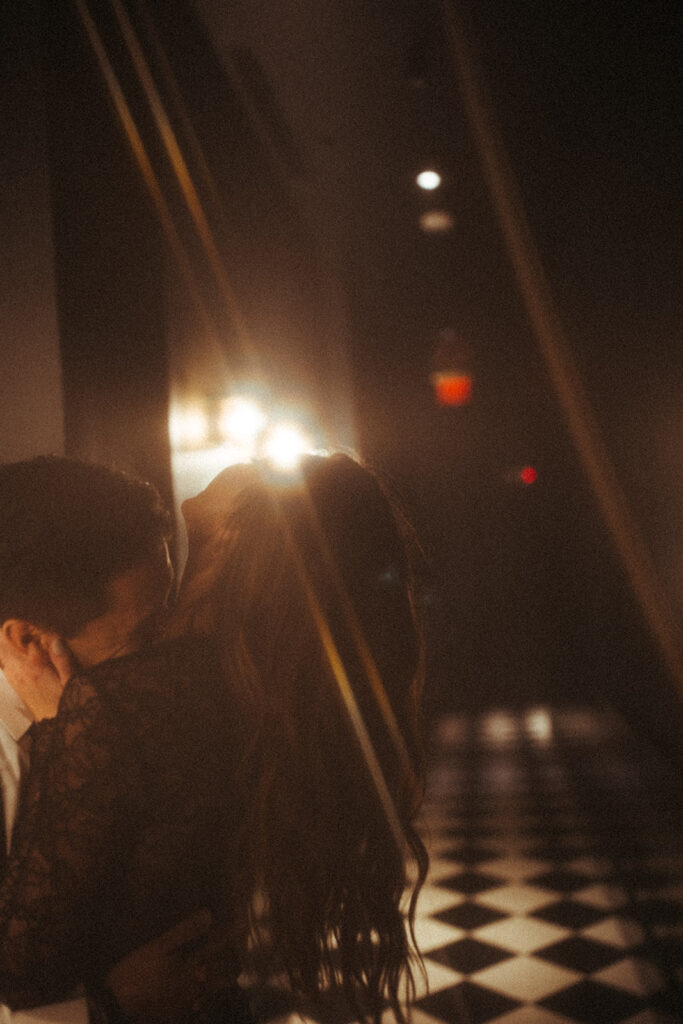 Couple kissing in a hallway