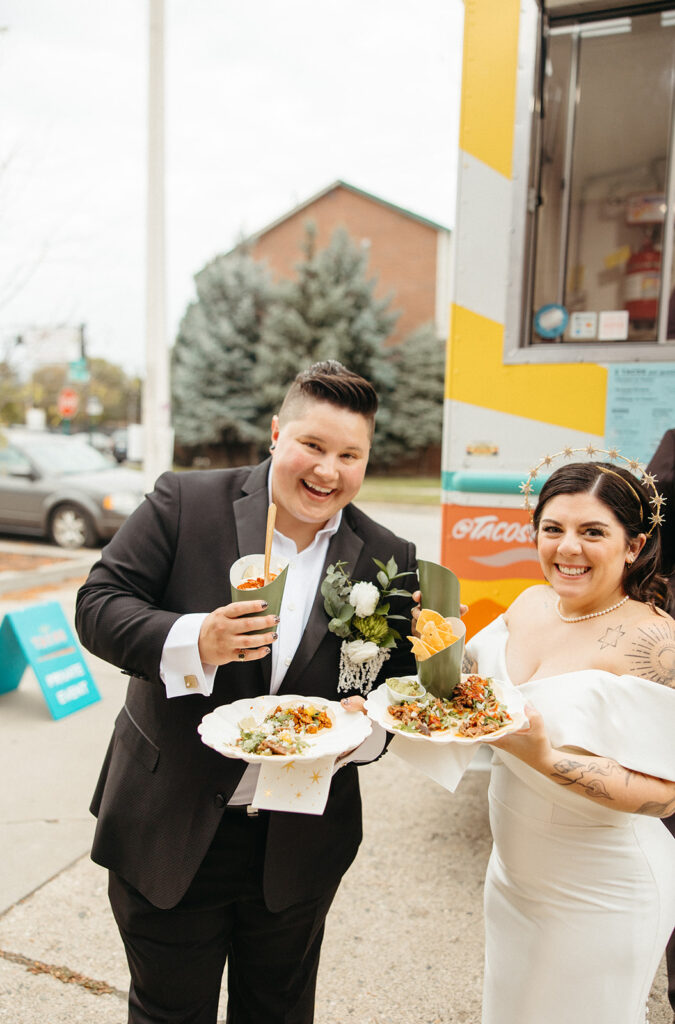 Couple getting food from the taco truck at their wedding reception
