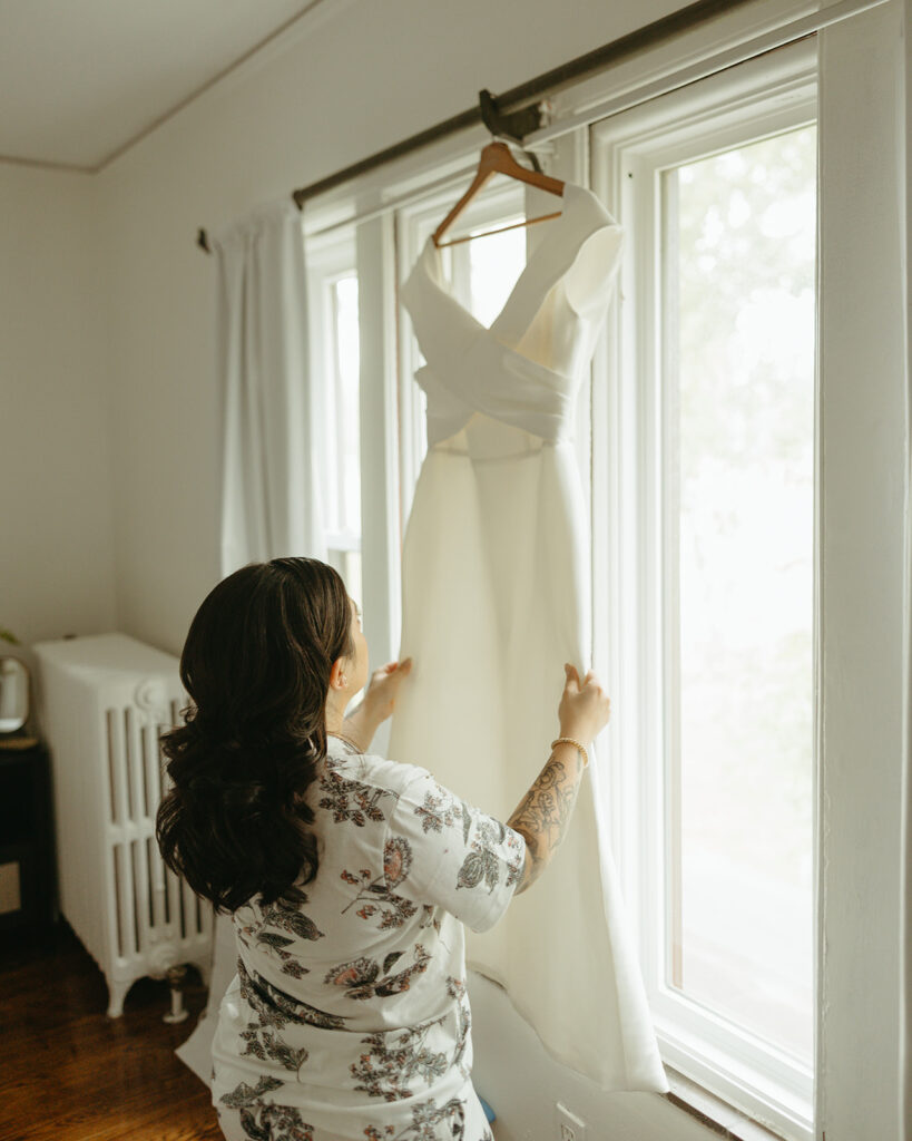 Woman admiring her wedding dress