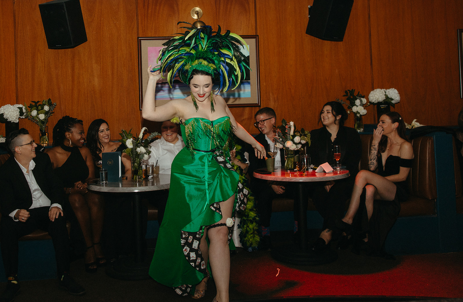 Burlesque dancer dancing for couple and their wedding party at Willis Show Bar