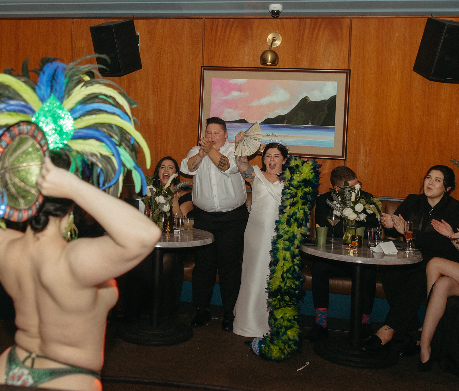 Burlesque dancer dancing for couple and their wedding party at Willis Show Bar