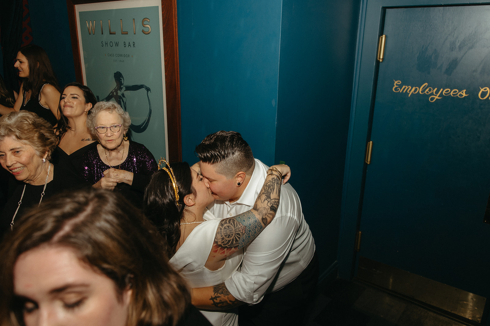Couple kissing during their Detroit wedding reception at Willis Show Bar