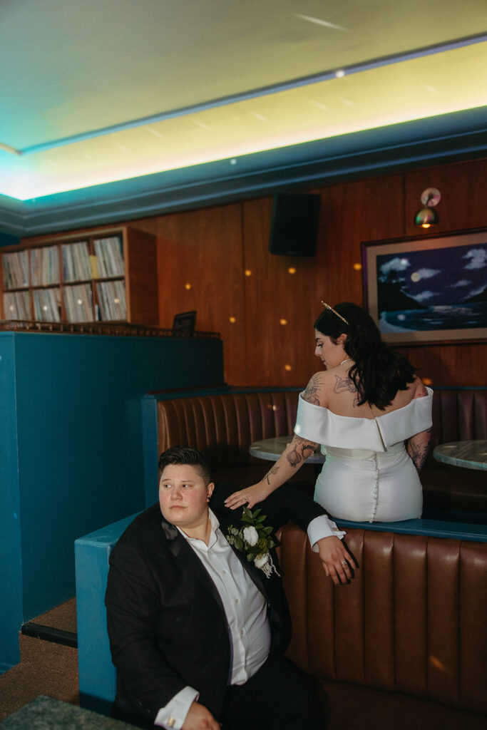 Couple posing for portraits at Willis Show Bar after their Detroit wedding