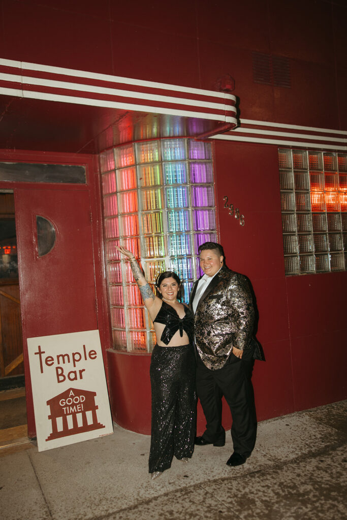 Couple posing for photos at their disco themed after wedding party at Temple Bar