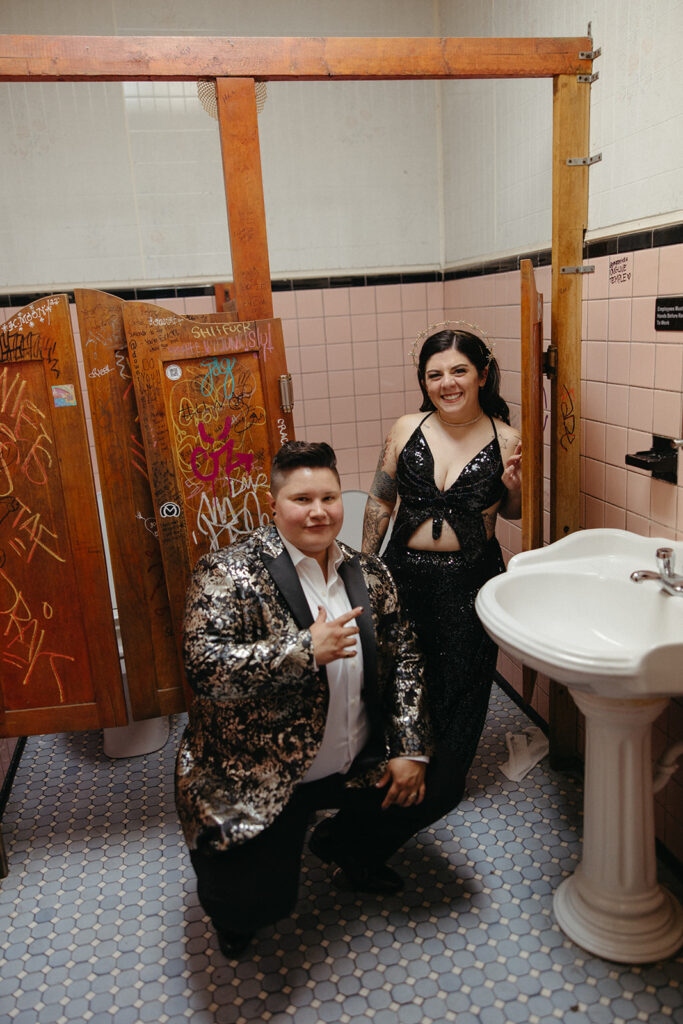 Couple posing for photos at their disco themed after wedding party at Temple Bar