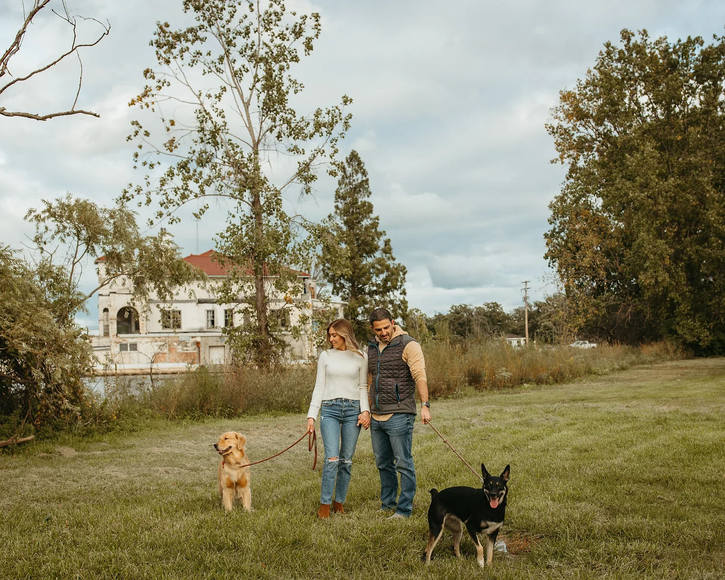 Couples Michigan engagement photos with their two dogs