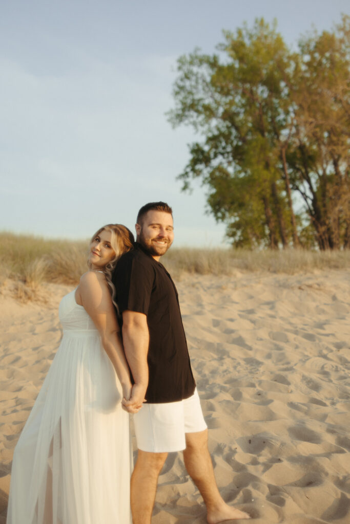 Couple at Sleeper State Park for their Michigan beach engagement photos