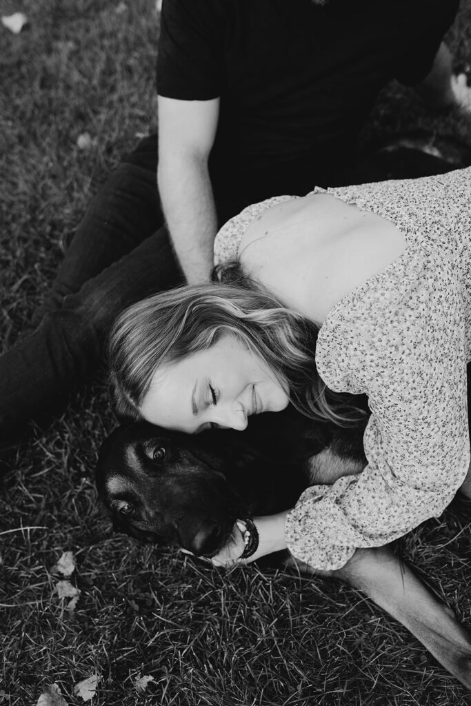 Couple and their dog cuddling for photoshoot
