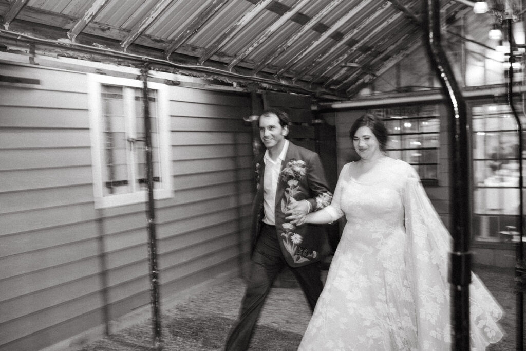 Bride and groom entering their Greenhouse at Goldner Walsh wedding reception