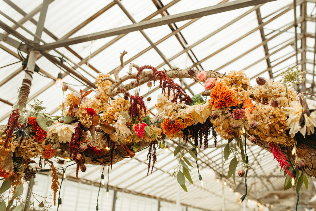 Florals from a Greenhouse at Goldner Walsh wedding reception captured by Marissa Dillon Photography
