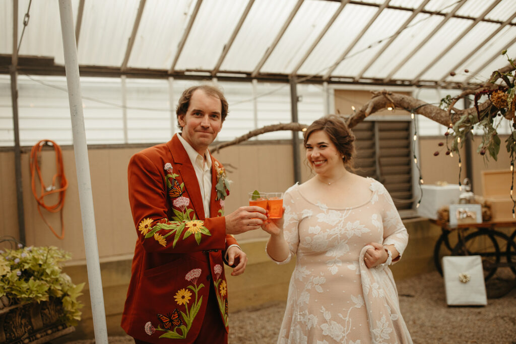 Bride and groom during cocktail hour from a Greenhouse at Goldner Walsh wedding reception 