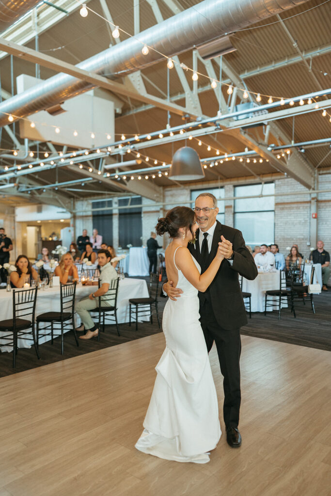 Bride dancing with her father during her Baker Lofts Holland MI wedding reception