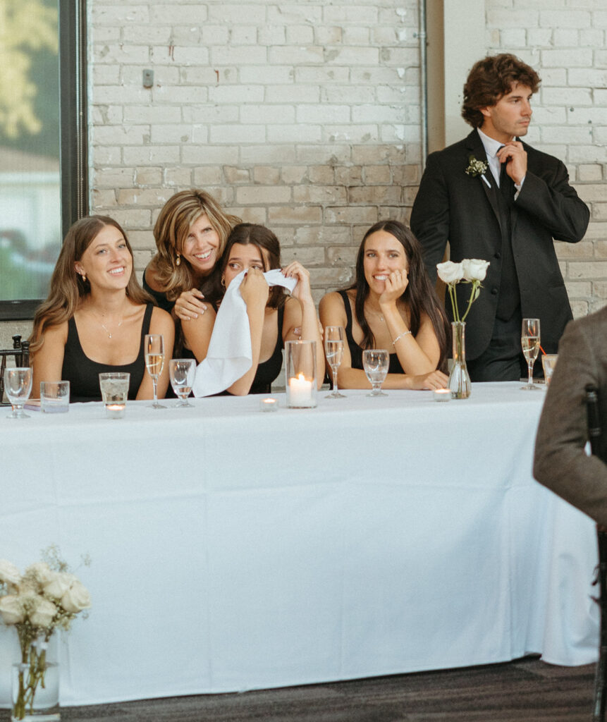 Bridesmaids getting emotional as she watches bride dancing with her father