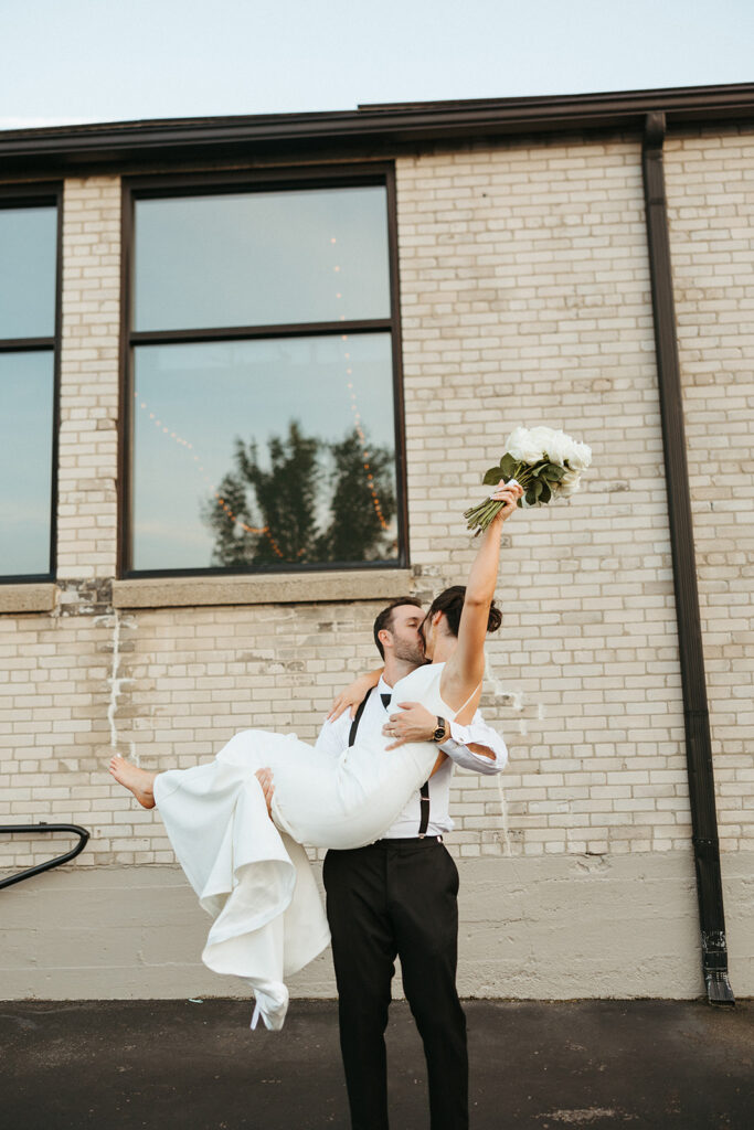 Bride and grooms portraits at Baker Lofts Holland Mi wedding venue