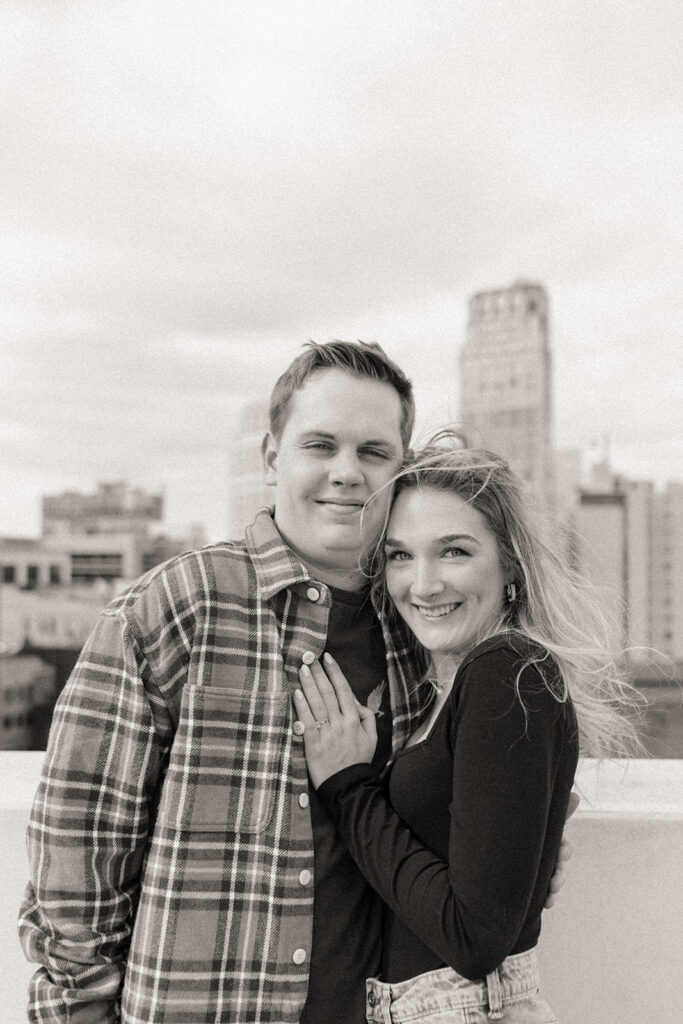 Black and white photo of a couple posing for their downtown Detroit engagement photos up on Z Lot