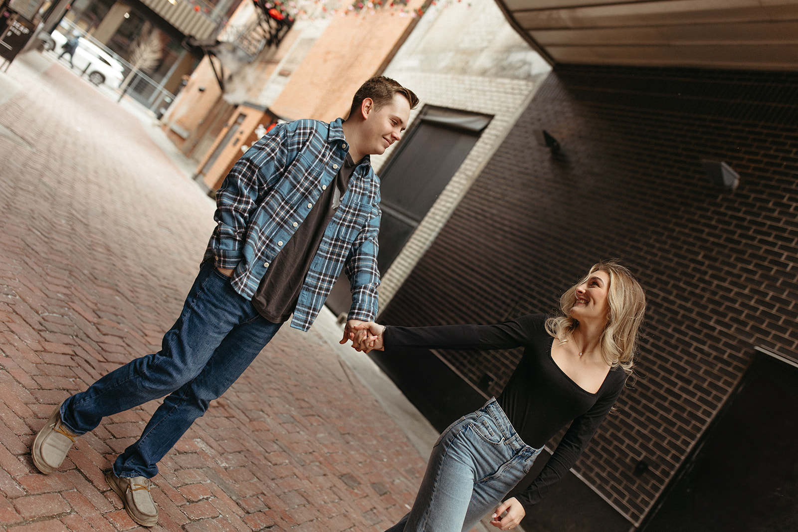 Couple holding hands as they walk down The Belt alley in Detroit, Michigan