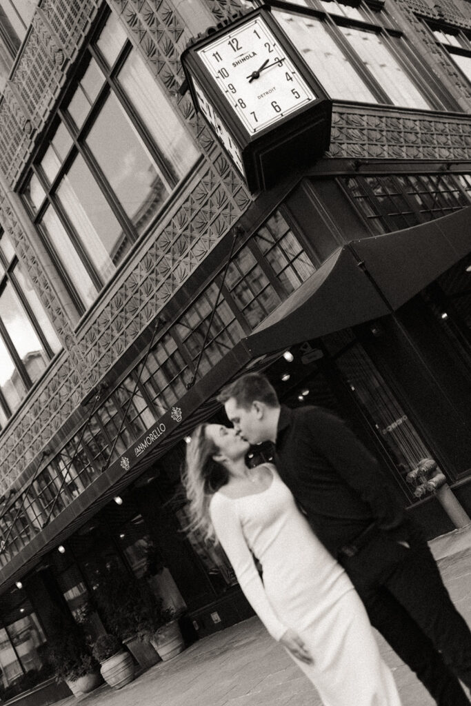 Black and white photo of a couple kissing for their downtown Detroit engagement photos