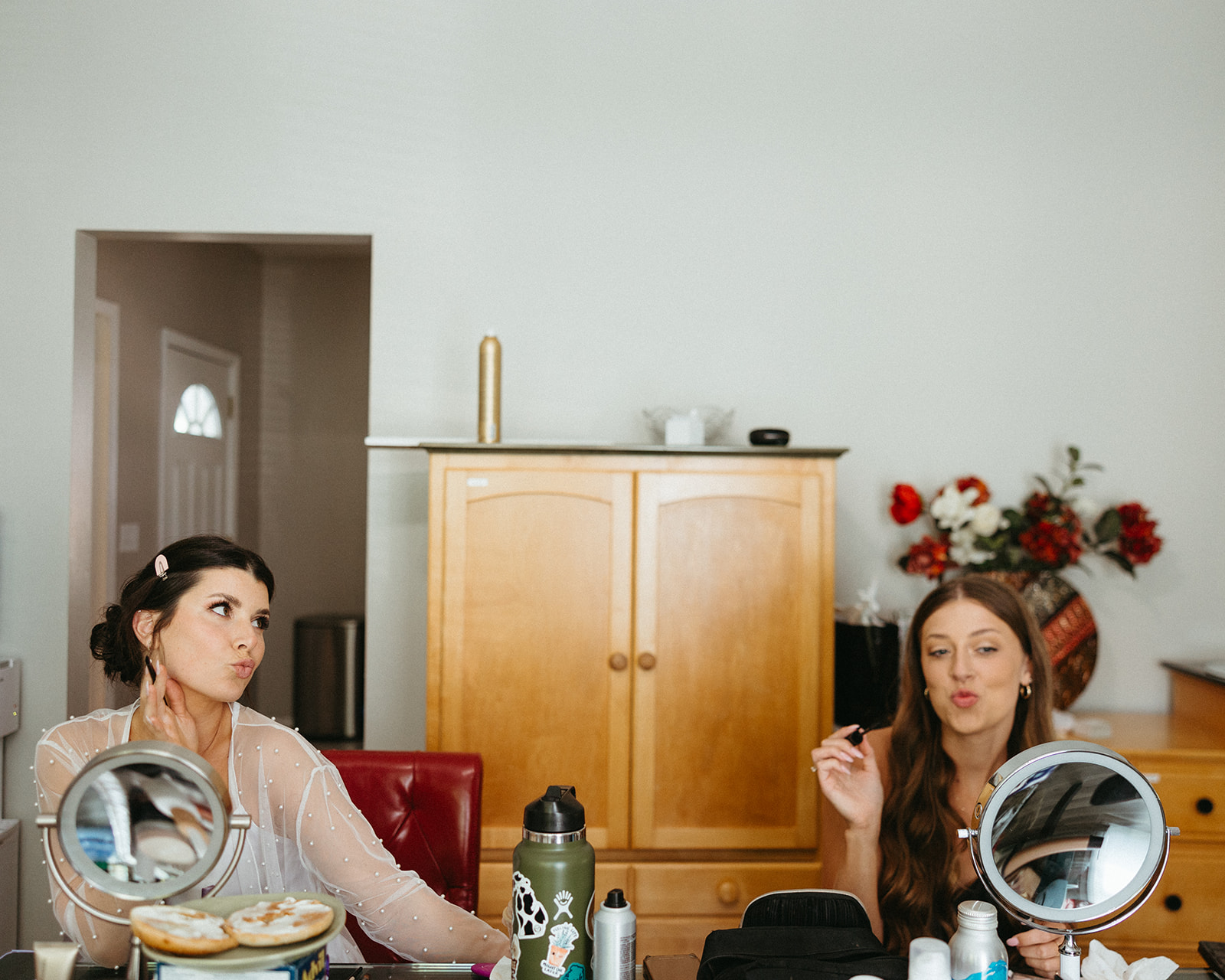 Bride getting ready with her bridesmaids for her Grand Rapids wedding