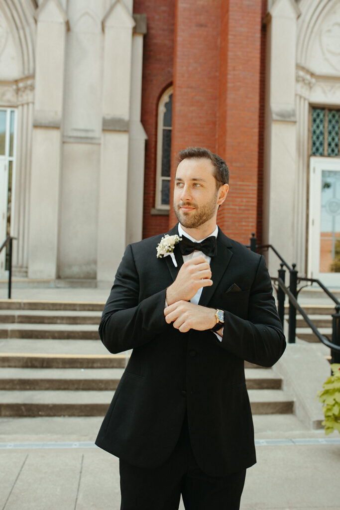 Grooms portraits in front of a church for a Grand Rapids wedding