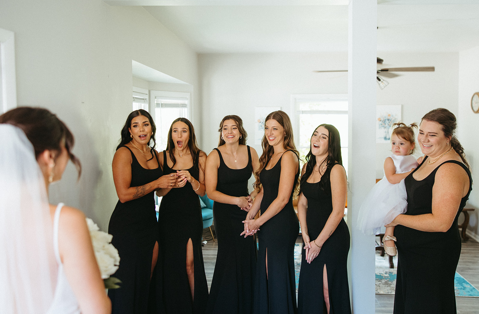 Bride sharing her first look with her bridesmaids