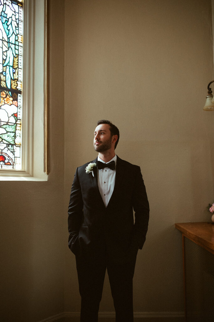 Grooms portraits inside a church from a Grand Rapids wedding