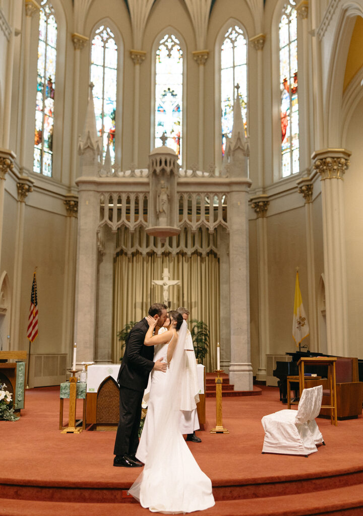 Bride and groom kissing during their Grand Rapids wedding ceremony