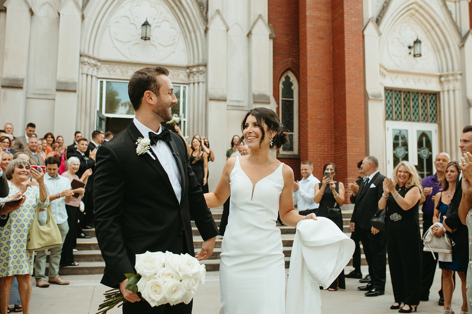 Bride and grooms portraits during their Grand Rapids wedding ceremony exit