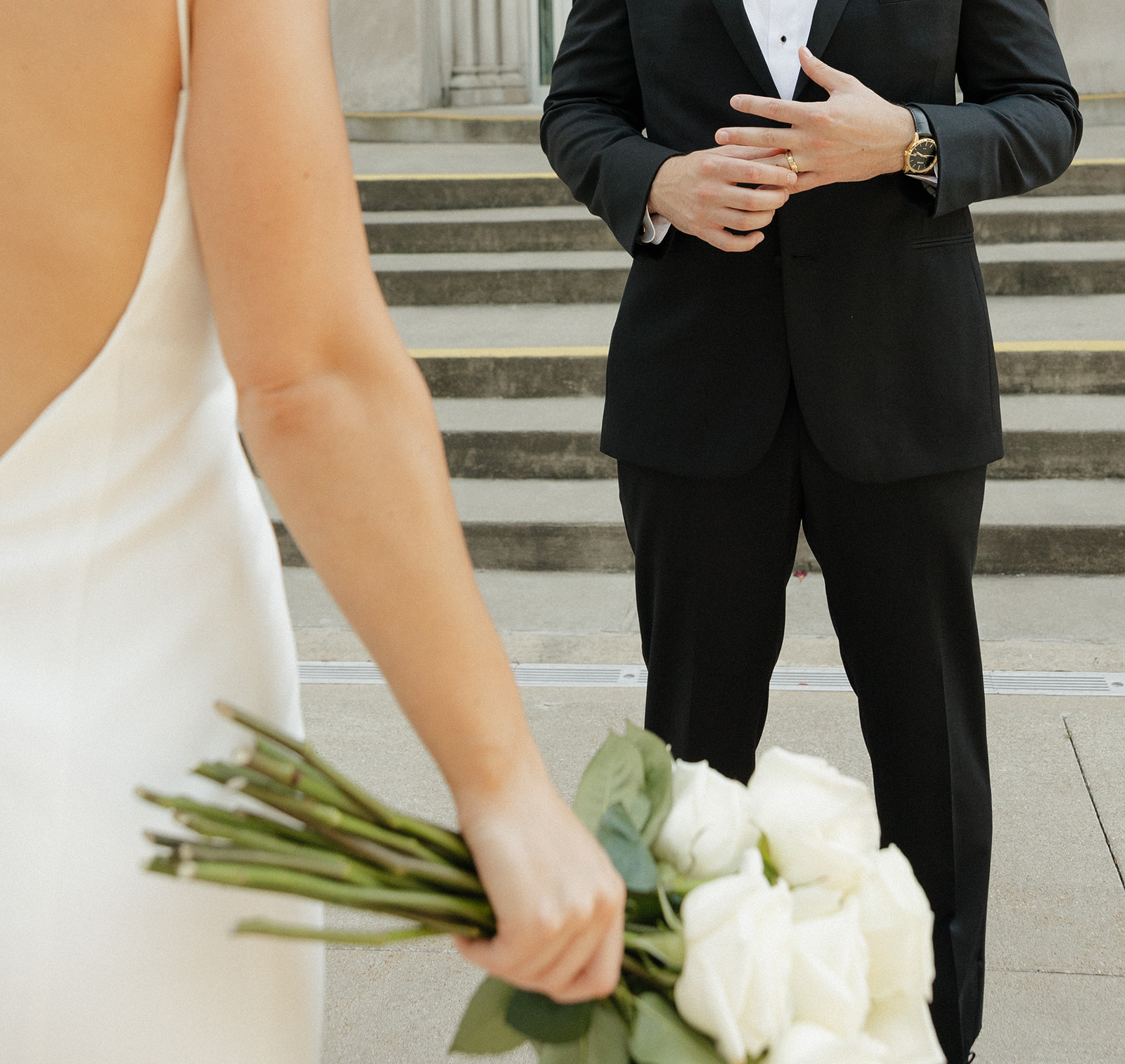 Close up shot of a bride and groom posing in an editorial style