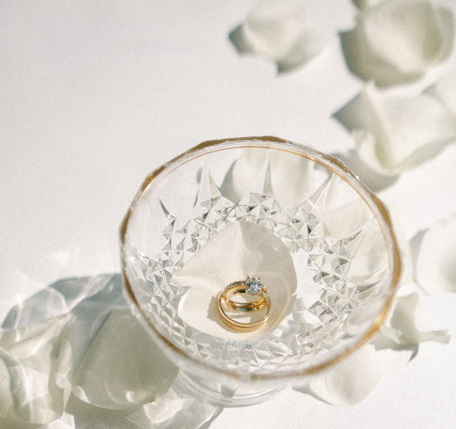 Shot of a wedding ring in a glass bowl for wedding ring detail shots