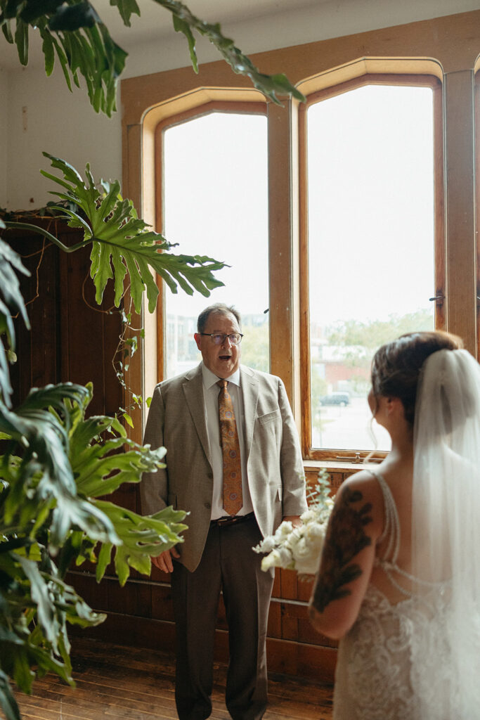 Father seeing his daughter for the first time in her wedding dress