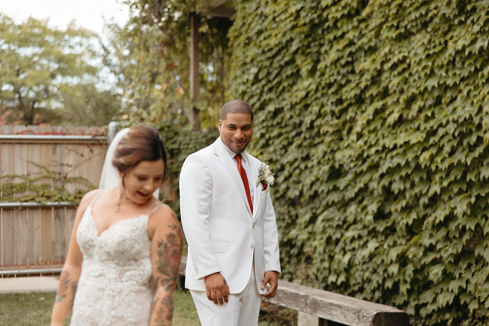 Groom admiring his bride to be in her wedding attire outside of Jam Handy wedding venue in Detroit, Michigan