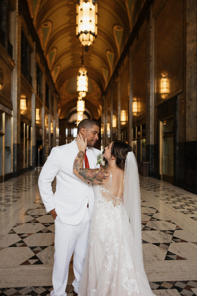 Bride and groom portraits in the Grand Arcade of Fisher Building in Detroit, Michigan
