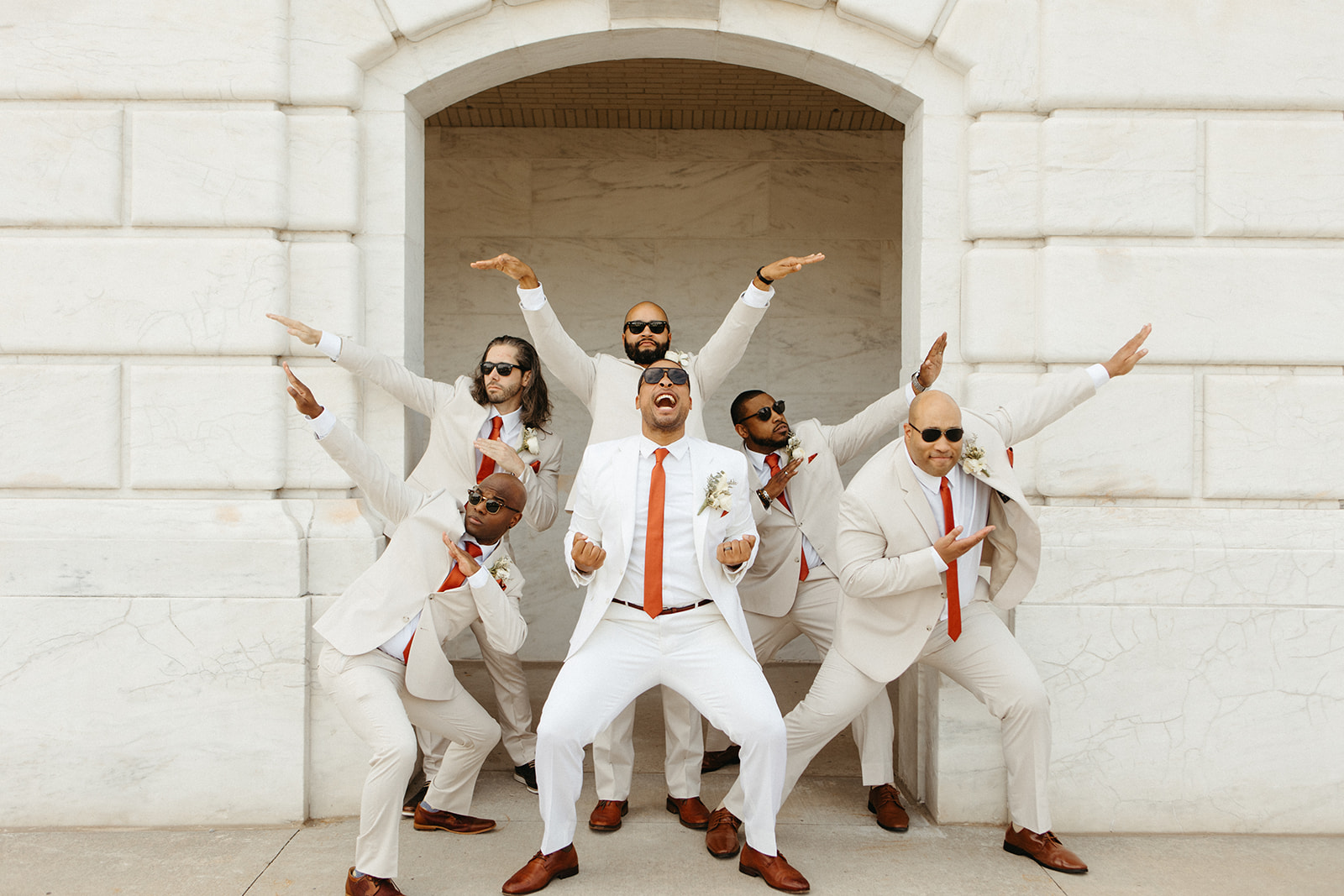 Funny groom and groomsmen portraits outside of Detroit Institute of Arts Museum