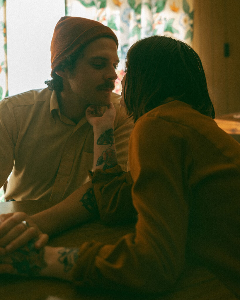 Man and woman sitting together at a kitchen table