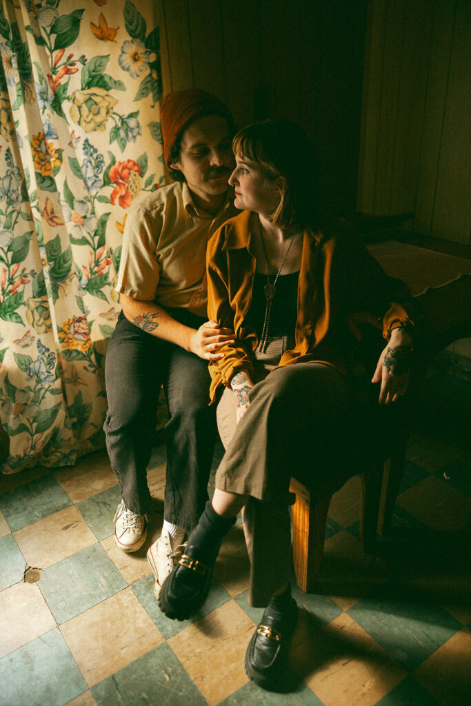 Couple posing for photos during their at-home vintage couple photoshoot in Michigan