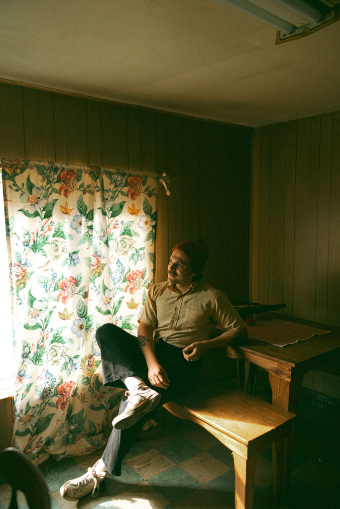 Man sitting at a dining table in a vintage house