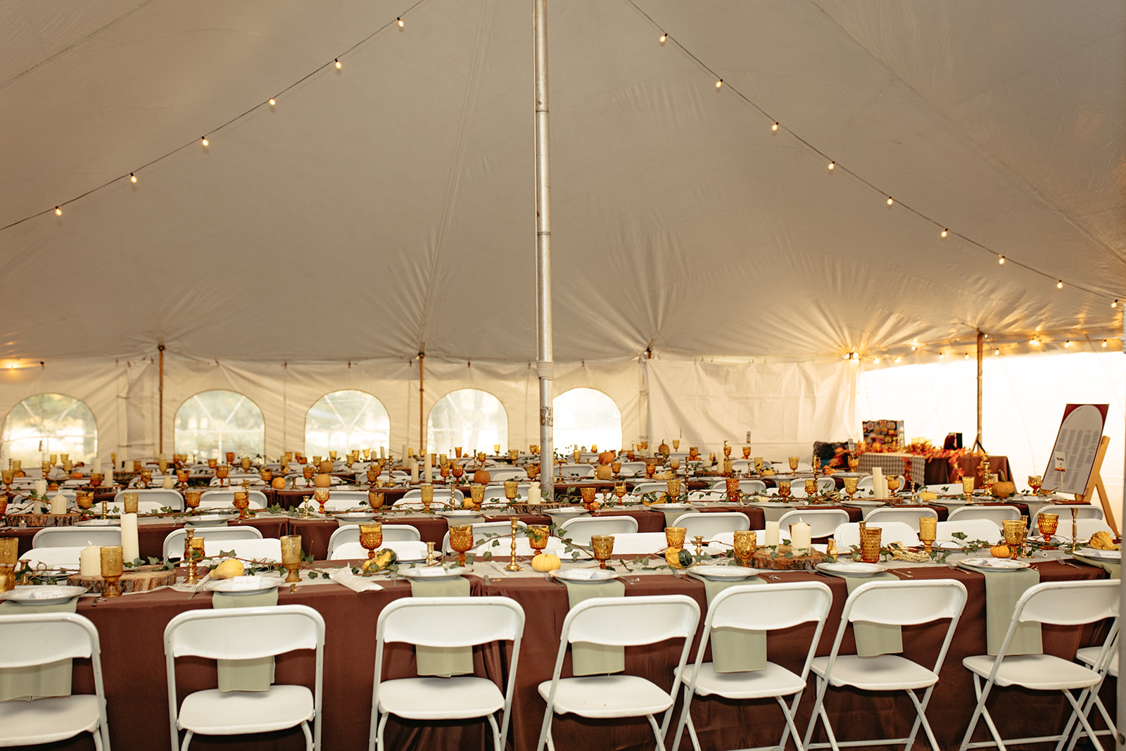 A beautiful outdoor wedding reception from a fall backyard wedding in Michigan