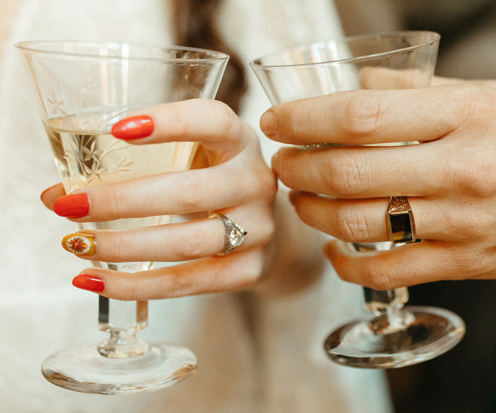 Bride and groom holding their celebratory drinks after their wedding ceremony