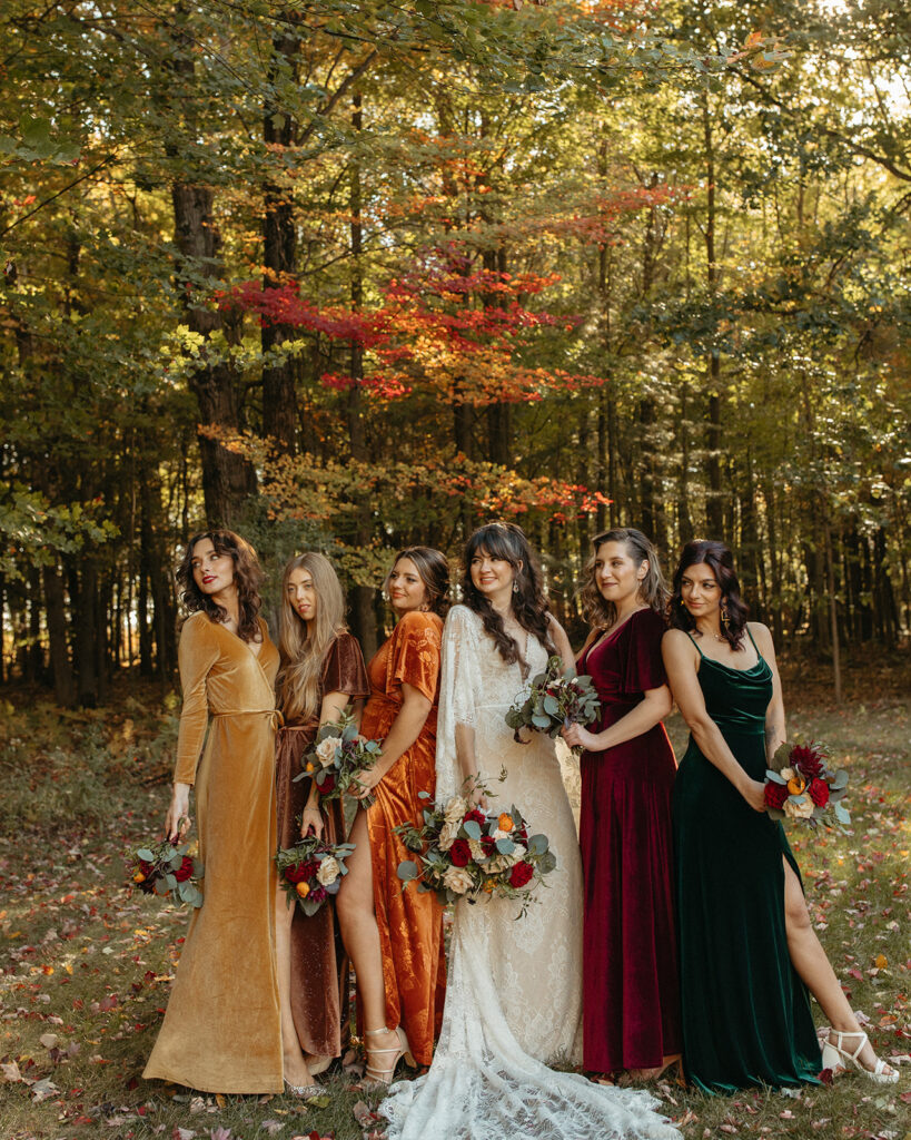 Outdoor bride and bridesmaids portraits with the brides wearing mismatched colored dresses