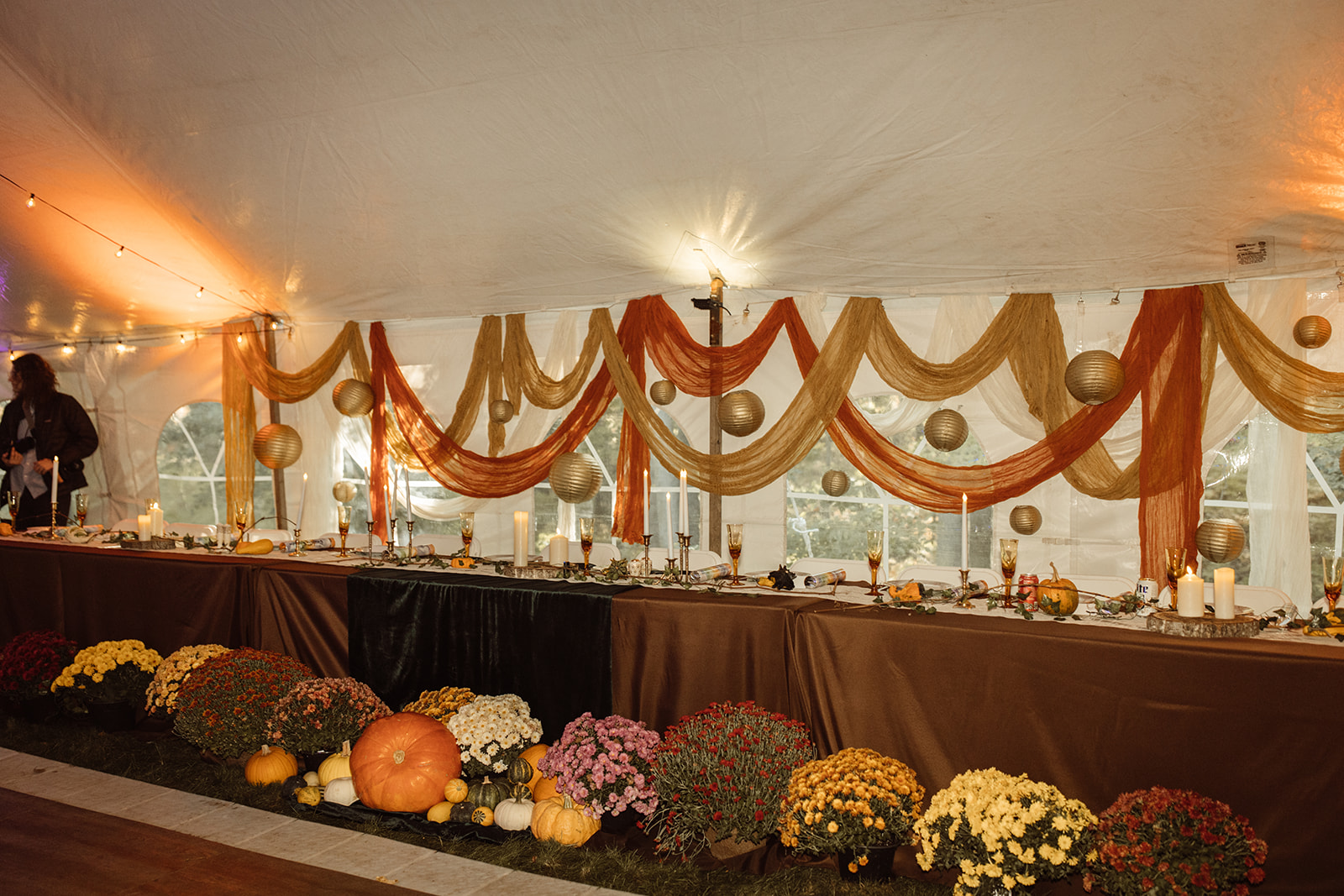 Unique fall wedding reception decor with florals and pumpkins