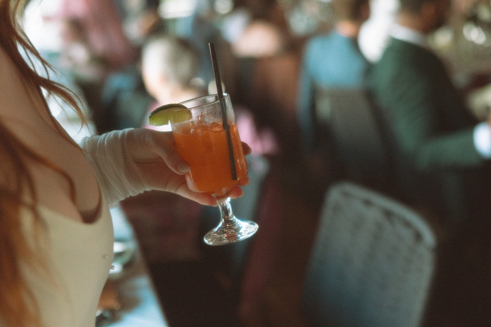 Bride holding a drink during her Detroit wedding reception