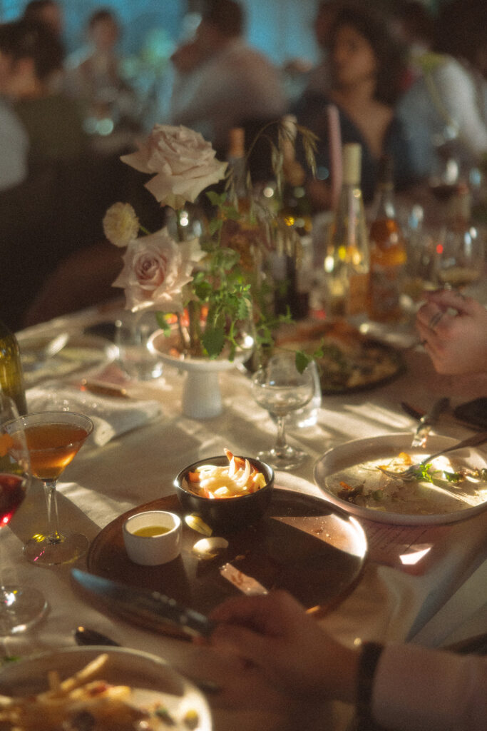 Documentary style wedding reception photo of guests eating during the reception