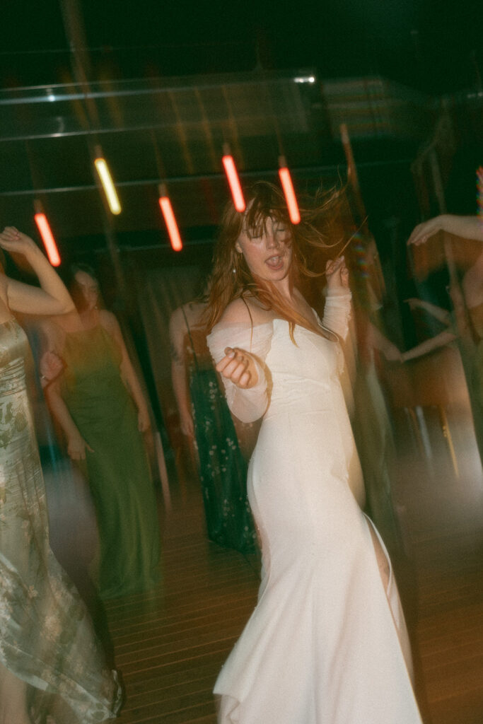 Bride dancing during her Detroit wedding reception at Mabel Grey