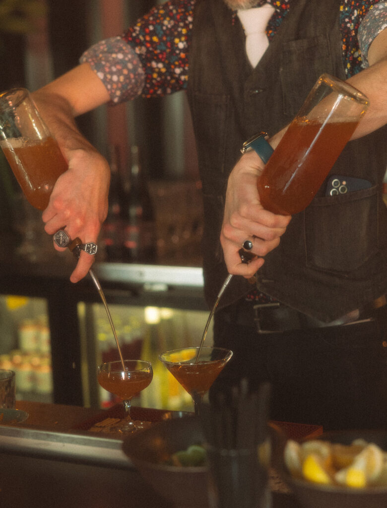 Bartender making drinks at a Detroit wedding reception at Mabel Grey