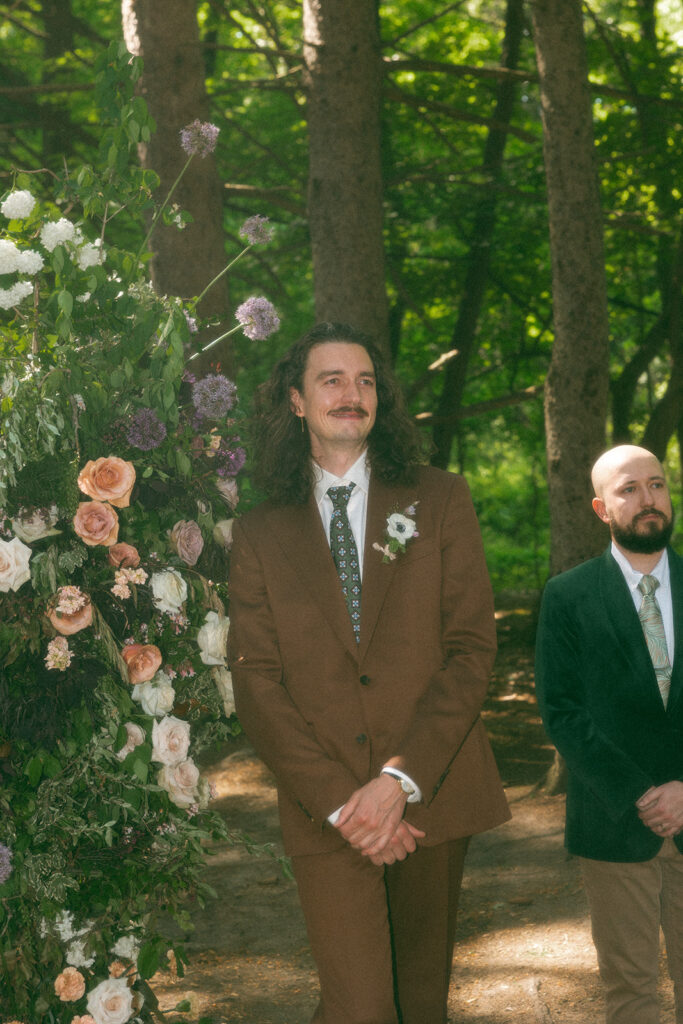 Groom getting emotional as he sees his bride walk down the aisle during their Stony Creek Metropark wedding in Detroit, Michigan