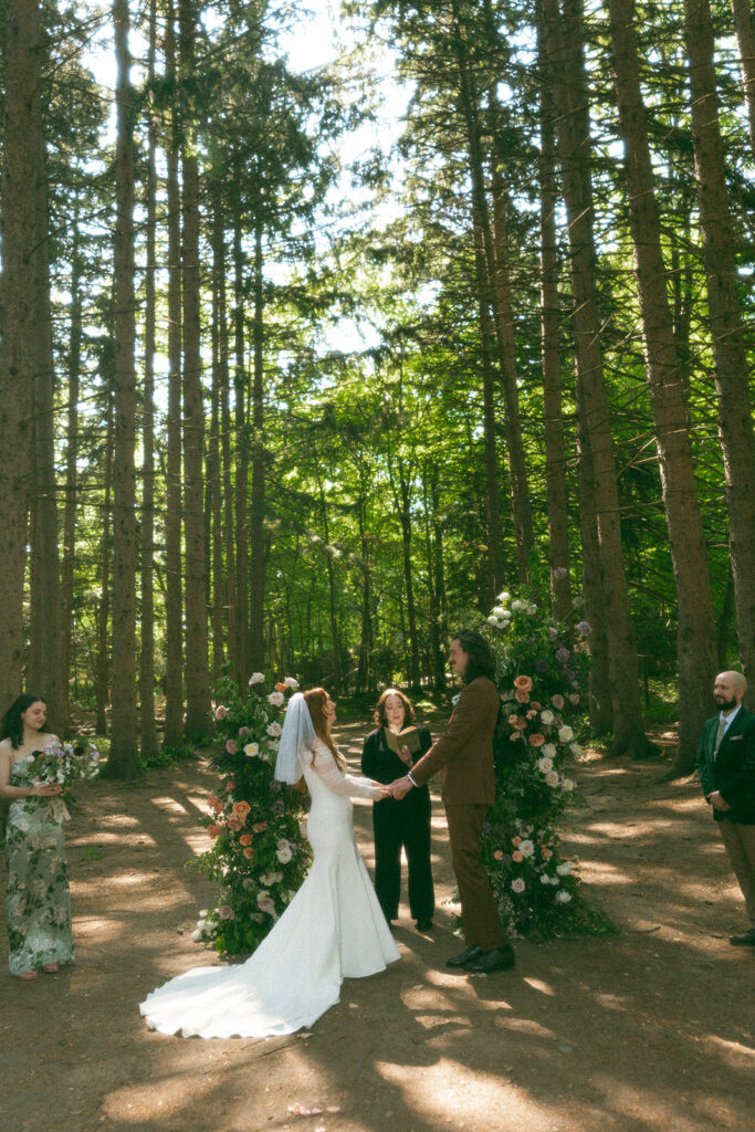 Bride and groom at the altar for their whimsical Stony Creek Metropark wedding in Detroit, Michigan