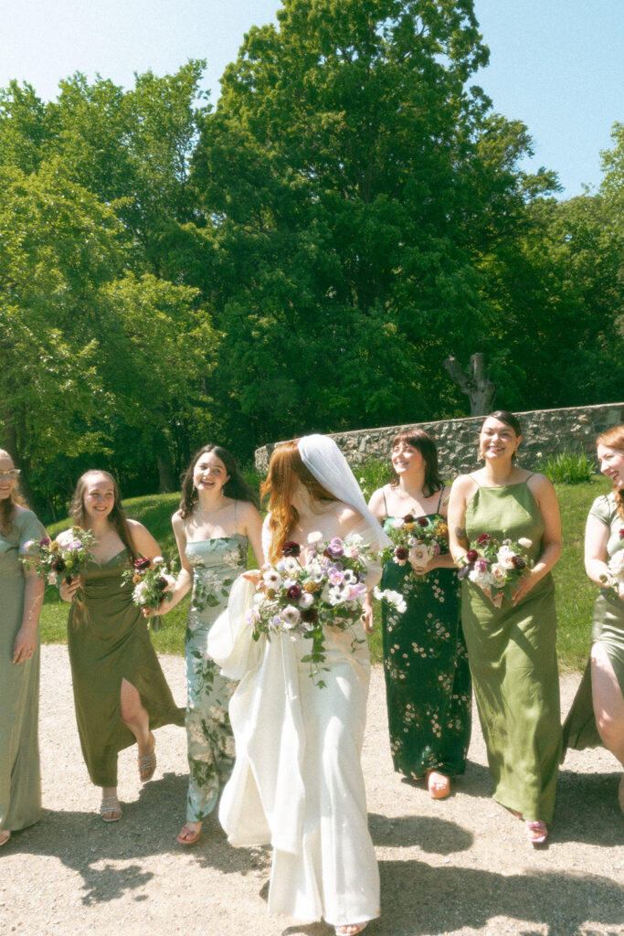 Bride and her bridesmaids from a whimsical outdoor Stony Creek Metropark wedding in Detroit, Michigan