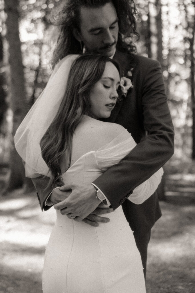 Black and white bride and grooms portrait from their Stony Creek Metropark wedding in Detroit, Michigan