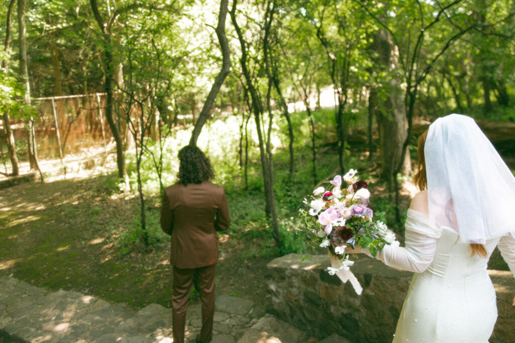 Bride and groom sharing their first look before their Stony Creek Metropark wedding ceremony in Detroit, Michigan