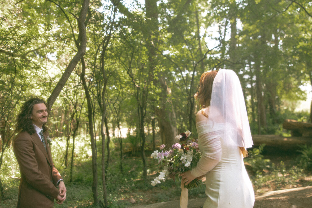 Bride and groom sharing their first look before their Stony Creek Metropark wedding ceremony in Detroit, Michigan